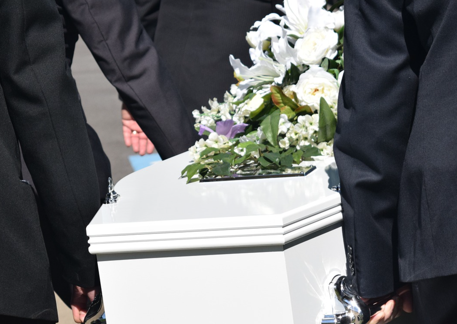 wrongful death claim carrying white casket