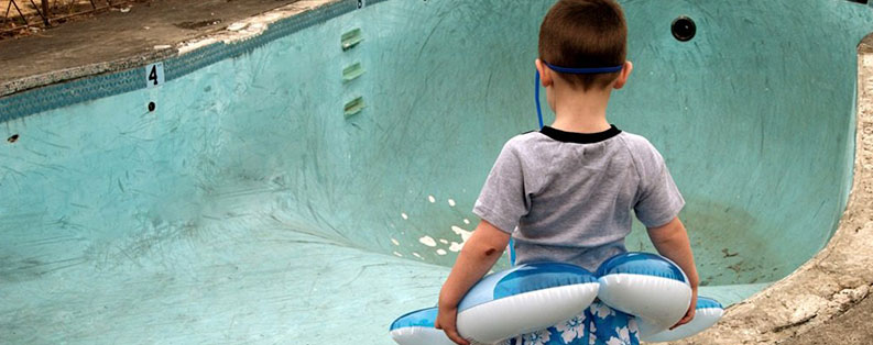 Kid at Empty pool attractive nuisance premises liability lawyer new york