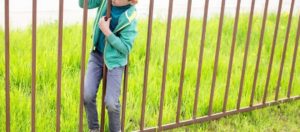 Kid squeezing through fence attractive nuisance premises liability new york
